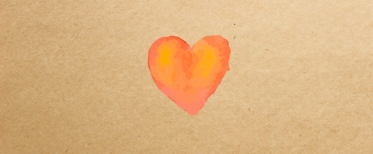 Kuvituskuva, jossa on ruskeaan paperiin maalattu oranssi sydän.